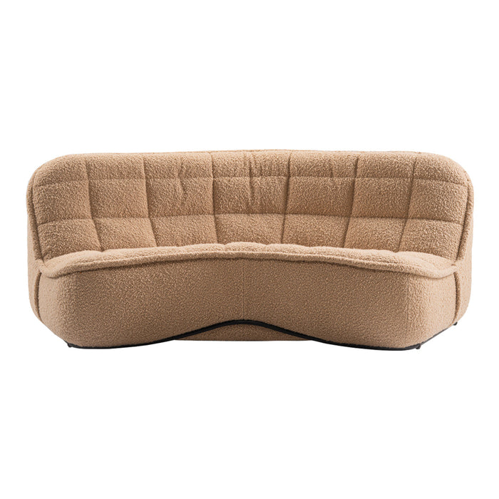Tan curved sofa with a cozy quilted texture, featuring a modern, plush design ideal for contemporary spaces.
