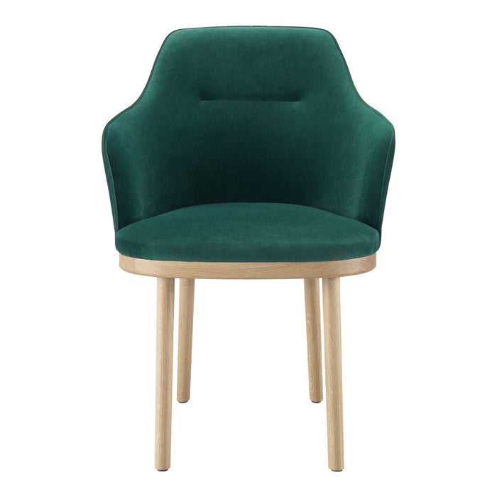 Green velvet chair with a smooth finish and natural wooden legs, featuring a modern, minimalist design.