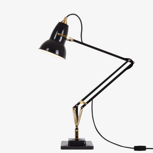 Black desk lamp with gold accents and a sleek, modern design, featuring a minimalist arm and base.