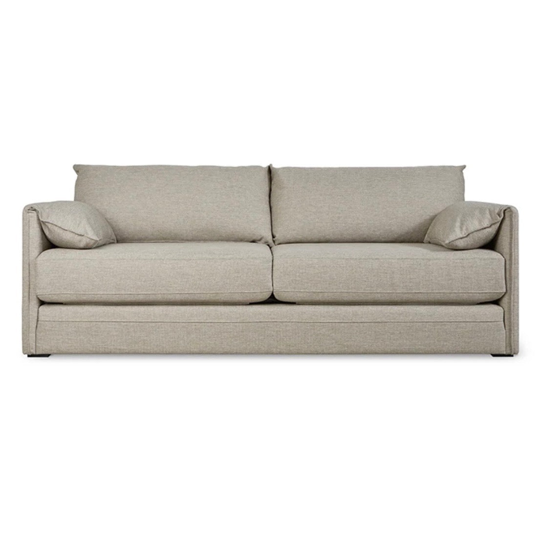 Light beige upholstered sofa with minimalist design and plush back cushions, featuring a smooth, textured fabric.