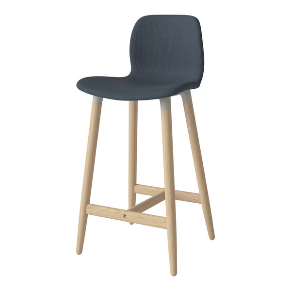 Modern navy blue bar stool with textured upholstery and light wooden legs, perfect for contemporary decor.