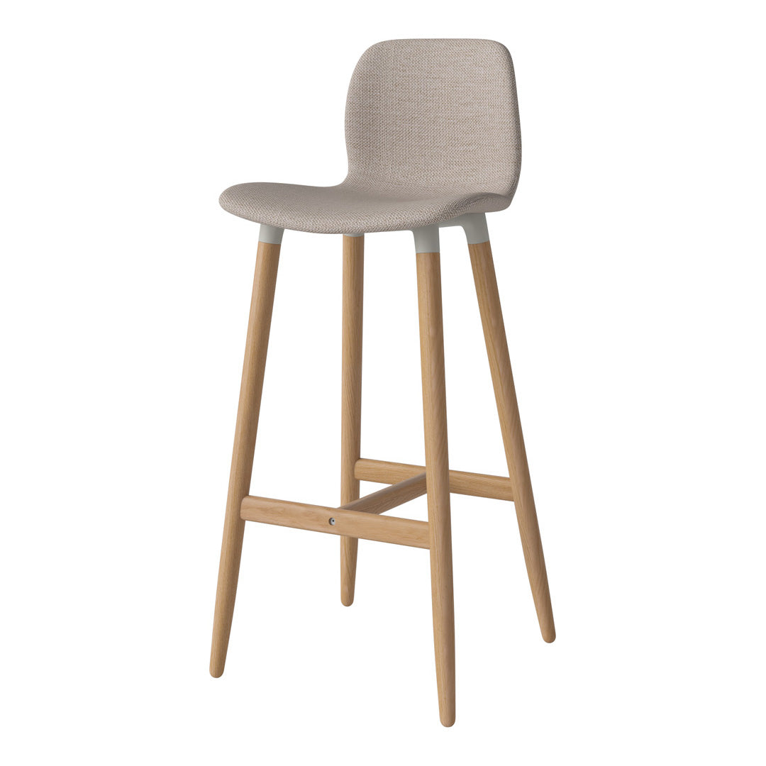 Beige fabric bar stool with light wood legs, featuring a minimalist and modern design.
