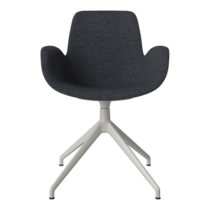 Dark gray upholstered chair with a smooth texture and minimalistic white legs. Modern design with clean lines.