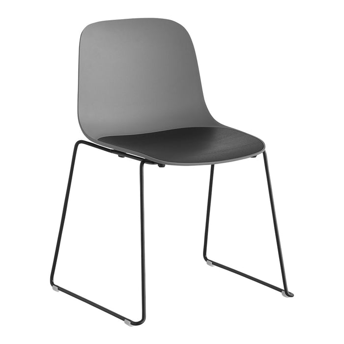 Stylish grey chair with a smooth matte finish and black seat, complemented by a sleek black metal frame.