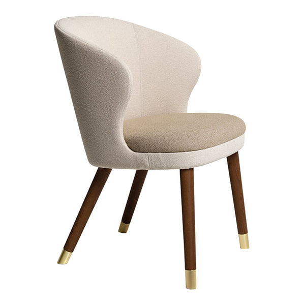 Beige and cream upholstered chair with wooden legs featuring gold accents. Modern design for elegant interiors.