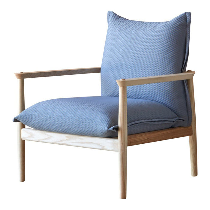 Light blue textured cushion chair with a natural wood frame, perfect for modern decor.