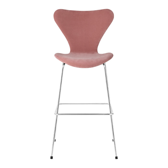 Pink upholstered chair with a smooth, curved design resting on a sleek chrome frame. Perfect for modern decor.
