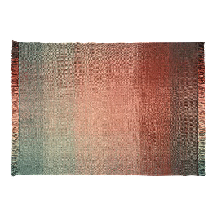 Ombre rug featuring soft hues of peach, coral, and teal with fringed edges for a stylish, contemporary look.