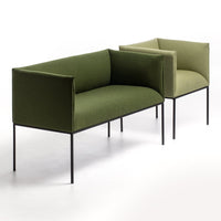 Green and olive upholstered sofas with sleek black legs, featuring modern, minimalist designs.