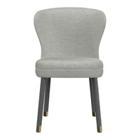 Light grey upholstered chair with a smooth, modern design and dark wooden legs featuring brass accents.