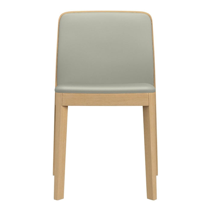Mint green upholstered chair with natural wood legs, showcasing a minimalist design and a smooth finish.