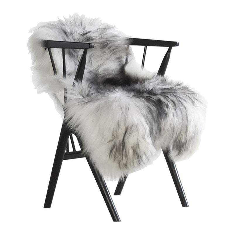 "Faux fur chair with a stylish gray and white pattern, complemented by a sleek black frame."