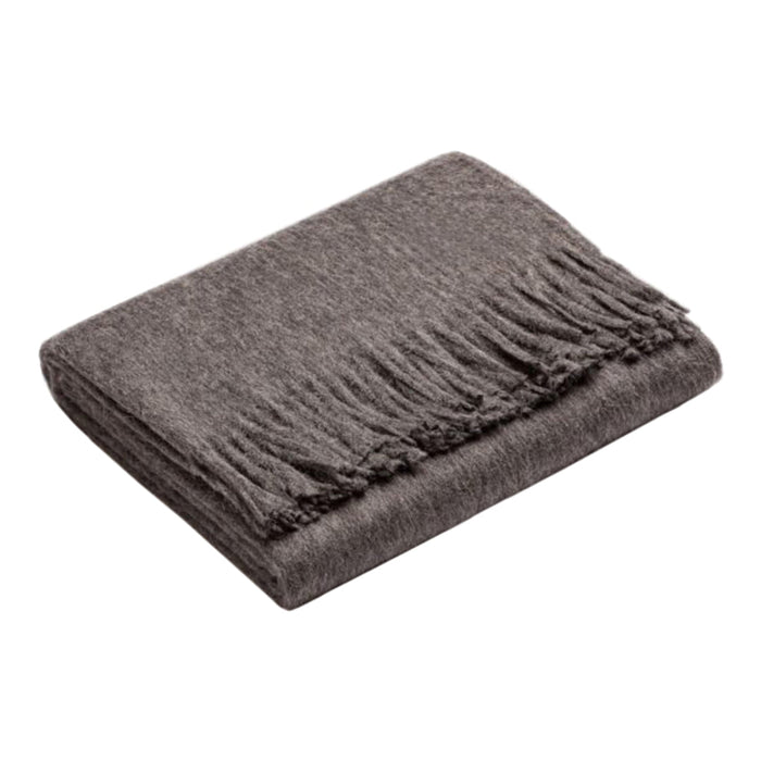 Soft gray throw blanket with fringed edges, perfect for cozying up in style. Ideal for any home décor.