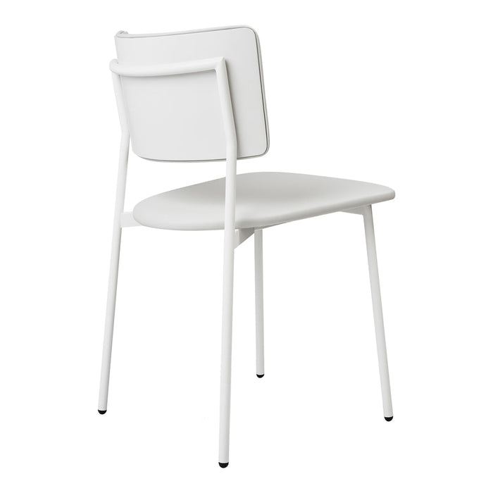 Minimalist white chair with a sleek design and smooth surface, featuring a simple pattern of clean lines.