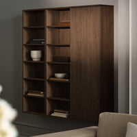 Dark wood bookshelves featuring sleek lines and open shelving for a modern, minimalist look.