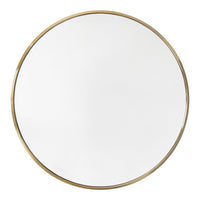 Round mirror with a sleek white surface and a shiny gold rim, perfect for modern decor.