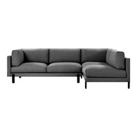 "Modern gray sectional sofa with clean lines and minimalistic design, featuring a textured fabric upholstery."