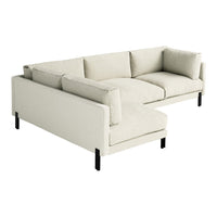 Light beige sectional sofa with a minimalist design and plush cushions, featuring black legs for contrast.