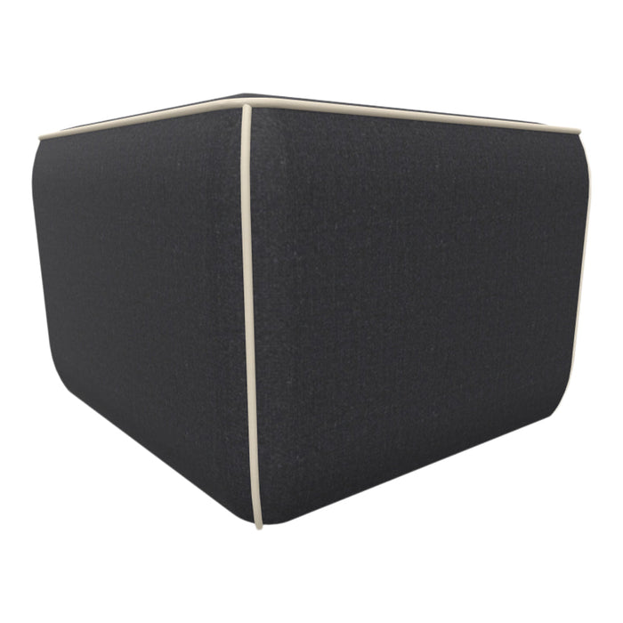 Dark gray cube ottoman with cream piping detail, featuring a textured fabric finish. Ideal for modern decor.
