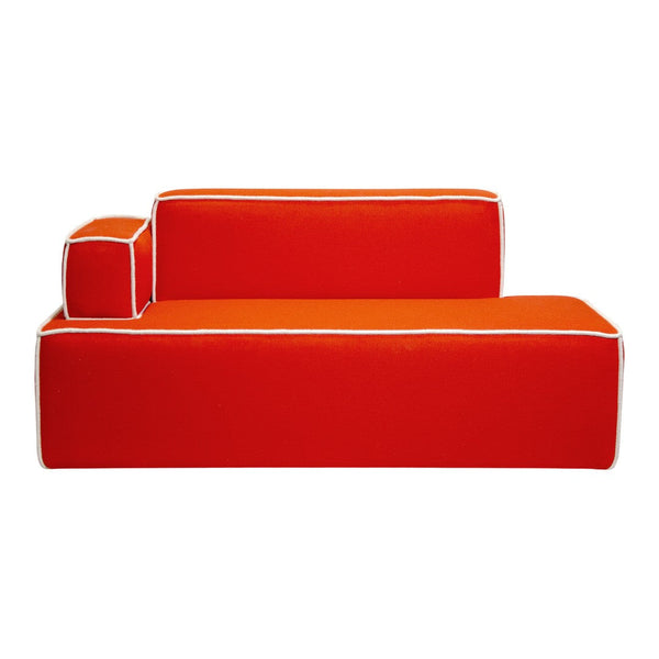 Vibrant red modular sofa with contrasting white piping and a bold orange cushion. Perfect for modern decor.