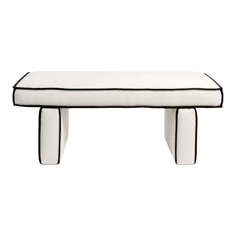White upholstered bench with bold black piping and sleek, modern design. Perfect for contemporary decor.