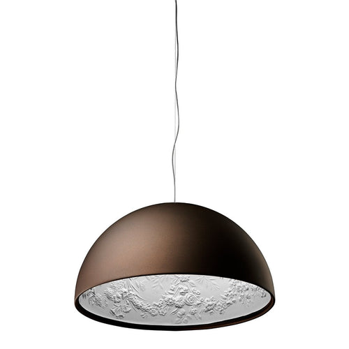 Brown dome pendant lamp with textured white interior, creating a striking contrast in colors and patterns.