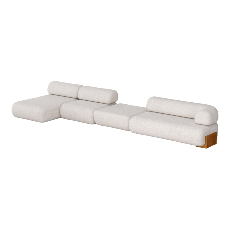 Cream-colored modular sofa with rounded edges and textured fabric, featuring natural wood accents.