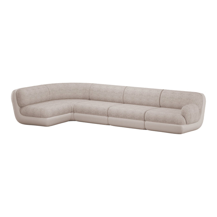 Beige sectional sofa with soft, textured upholstery and smooth leather accents; modern, minimalist design.