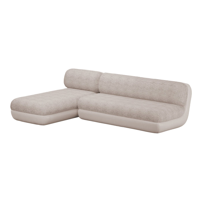 "Light beige sectional sofa with textured upholstery and smooth cream accents, perfect for stylish home decor."