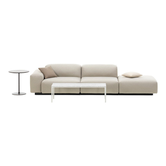 Modern beige sofa with a minimalist design, featuring soft, smooth upholstery and a neutral color palette.