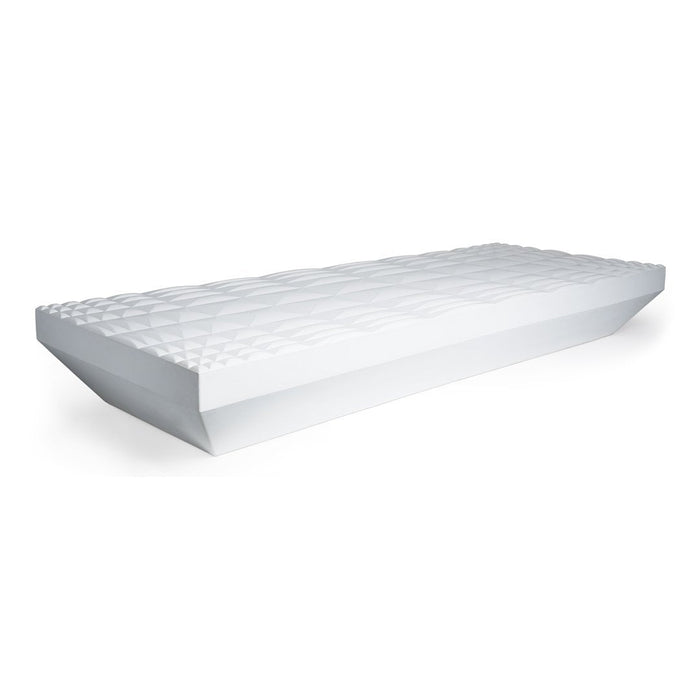 White mattress with a textured, geometric pattern on top, showcasing a clean and modern design.