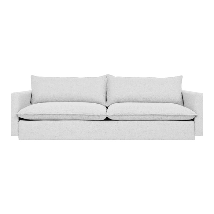 Light gray sofa with a minimalist design and soft, smooth fabric, featuring plush cushions and a sleek profile.