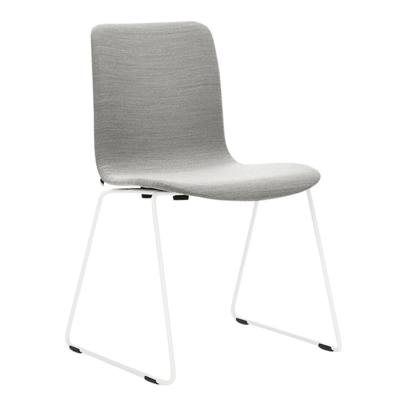 Gray upholstered chair with a smooth texture and white metal legs, showcasing a minimalist design.