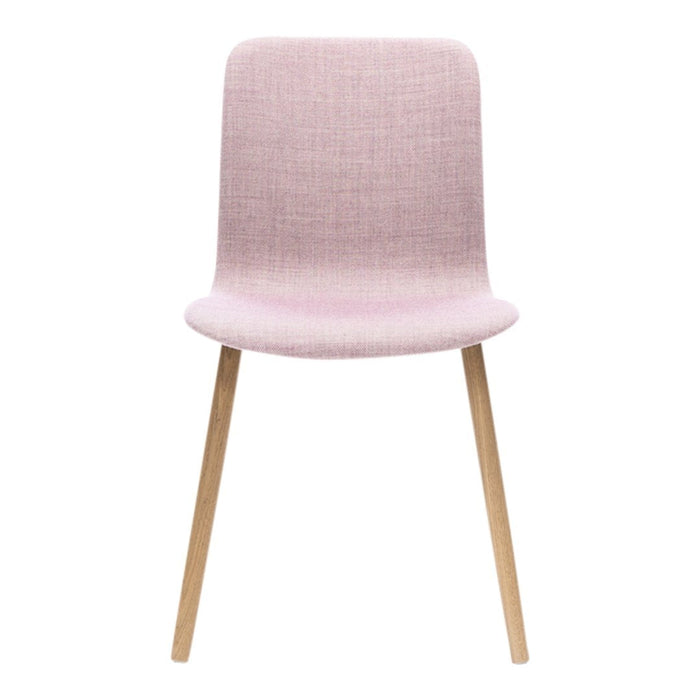 Light pink upholstered chair with a smooth texture and natural wooden legs.