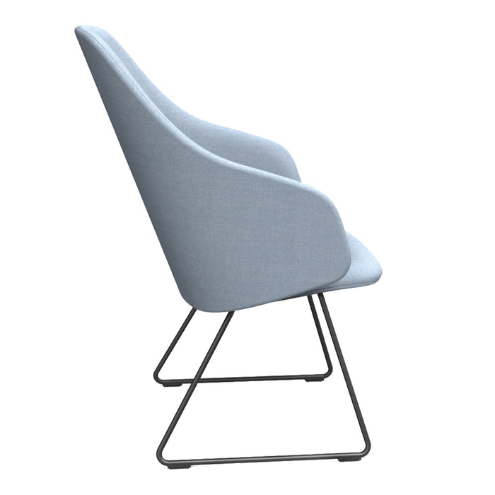 Light blue upholstered chair with a sleek design and smooth contours, featuring a minimalist metal base.