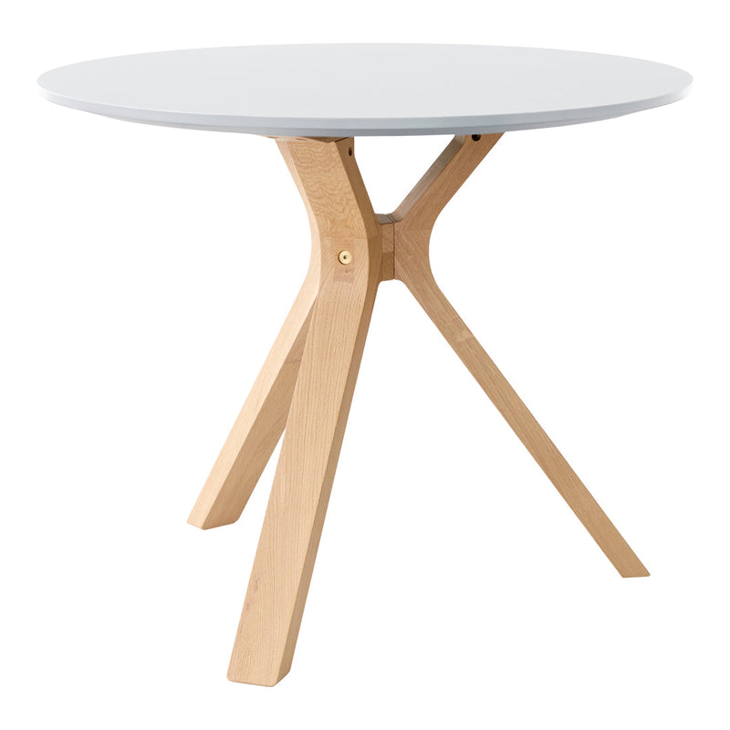 Round white tabletop with natural wood legs, featuring a sleek, minimalistic design and smooth finish.