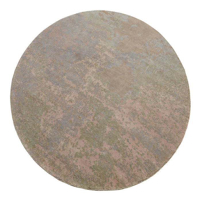 Round area rug featuring soft pastel colors and a textured, abstract pattern in pink, green, and blue hues.