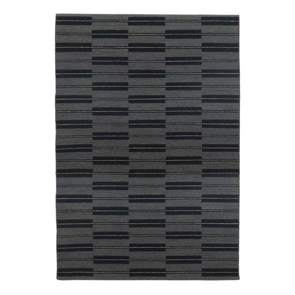 Gray area rug featuring a modern striped pattern in varying shades of charcoal and black. Ideal for stylish decor.