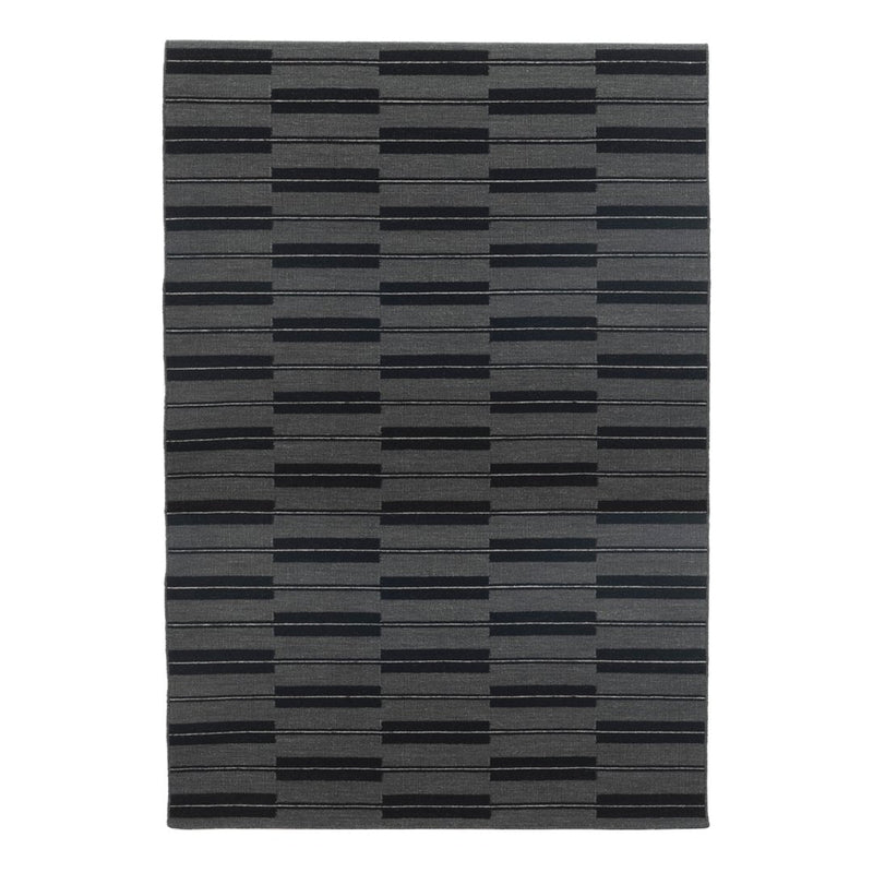Gray area rug featuring a modern striped pattern in varying shades of charcoal and black. Ideal for stylish decor.