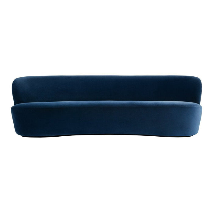 Dark blue velvet sofa with a smooth, curved design, featuring a solid color and no visible patterns.