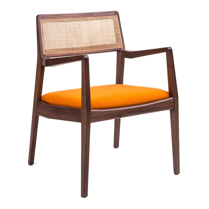 Wooden armchair with a natural cane back and vibrant orange cushion, showcasing a modern design aesthetic.