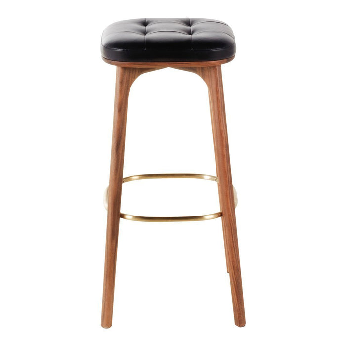 Black tufted seat with wooden legs and a gold footrest, ideal for modern decor. Stylish and durable design.
