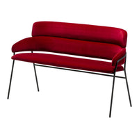 Velvet red sofa with smooth curves and a sleek black metal frame, ideal for modern interior decor.