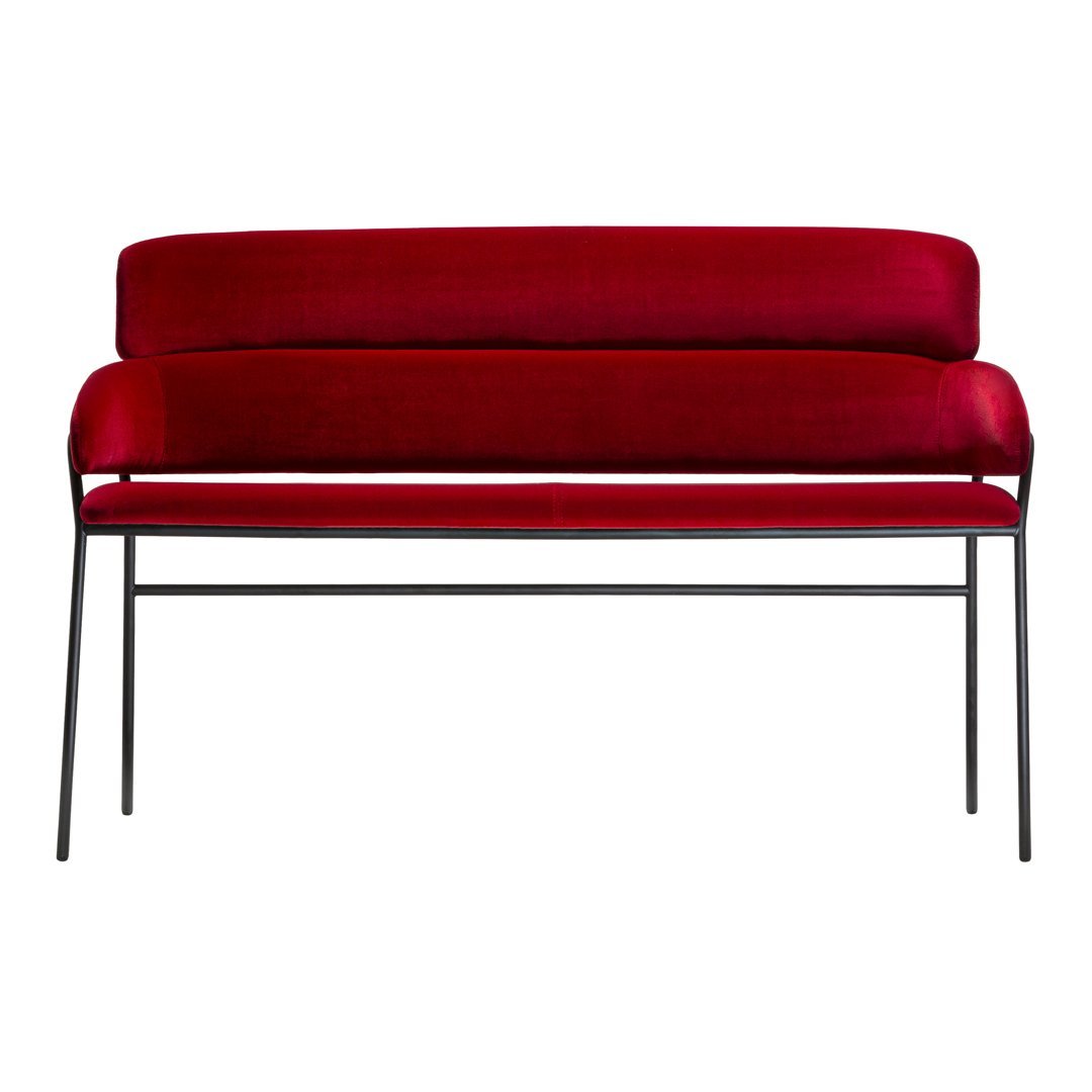 Red velvet two-seater sofa with sleek black metal legs and a simple modern design. Ideal for contemporary decor.