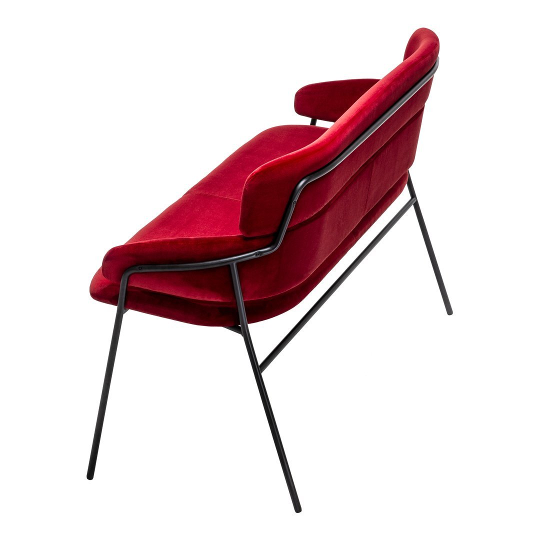 Red velvet armchair with a sleek black metal frame, featuring a contemporary design and smooth, minimalistic lines.