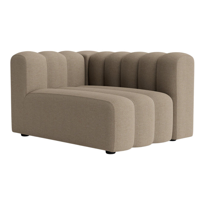 Beige modular sofa with a ribbed design, featuring smooth curves and a modern, minimalist style. Ideal for contemporary spaces.
