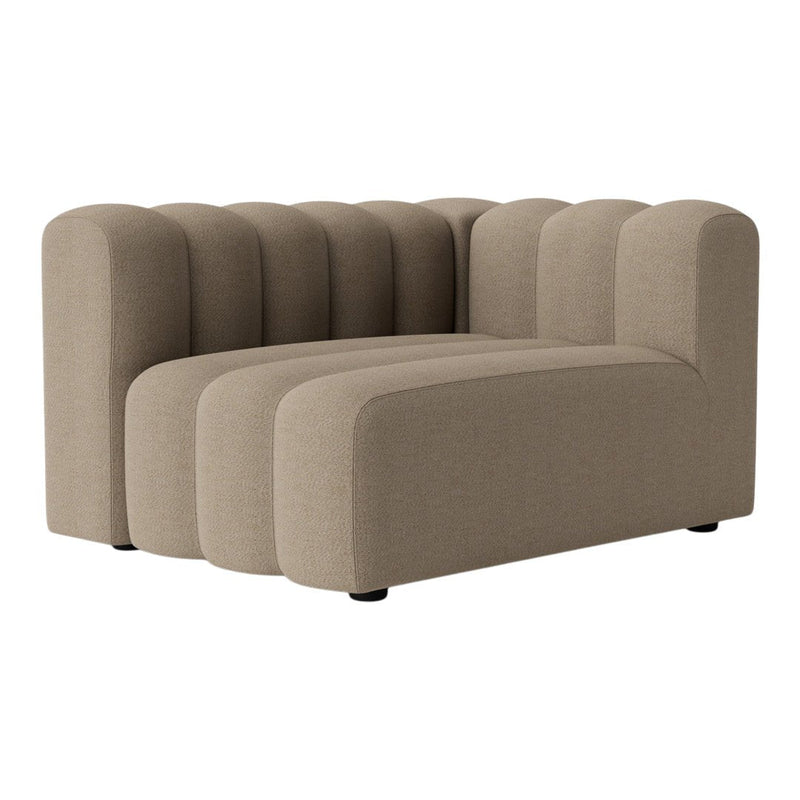 Beige curved sectional sofa with ribbed texture, featuring a modern design and soft fabric upholstery. Ideal for contemporary spaces.