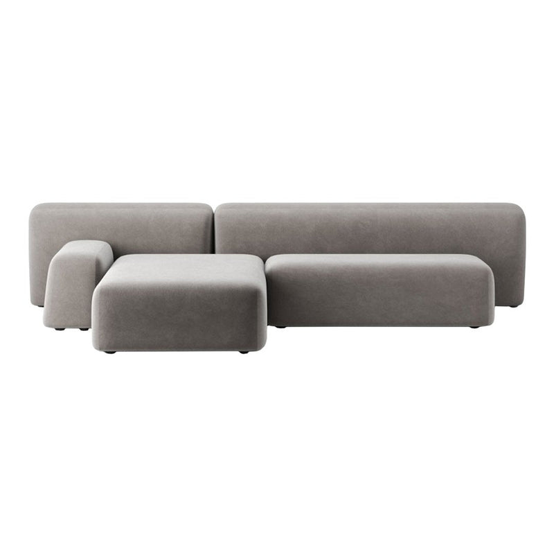 Stylish modular sofa in soft light gray fabric with a smooth texture and minimalist design.