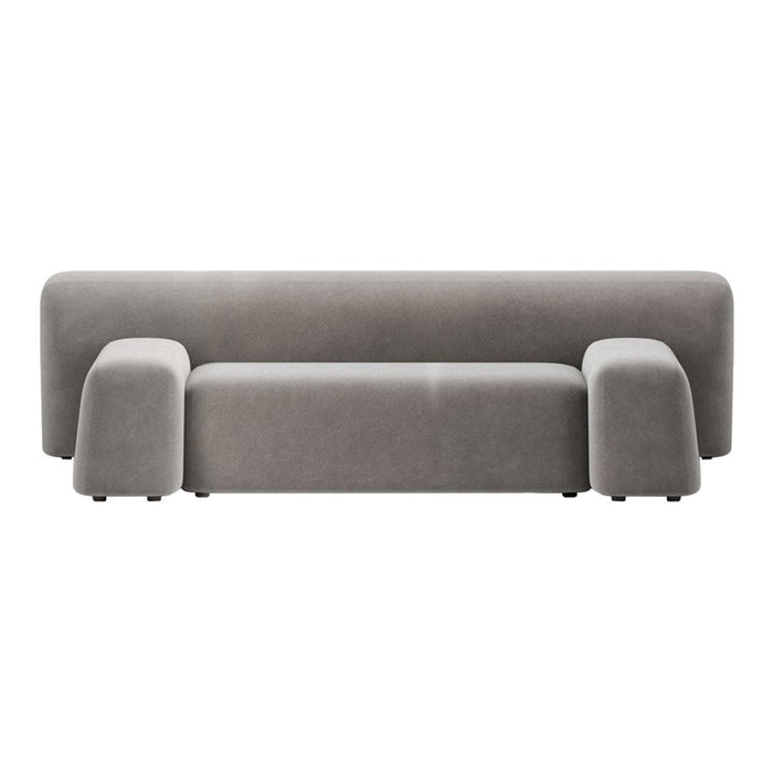 Gray velvet sofa with a sleek, minimalist design and rounded edges, featuring a uniform, soft texture.
