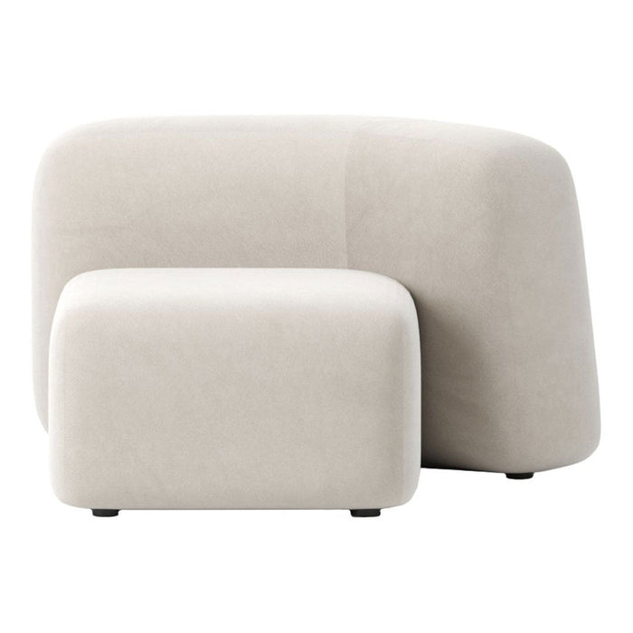 Beige curved sofa set featuring a soft, smooth texture and minimalistic design, perfect for modern interiors.